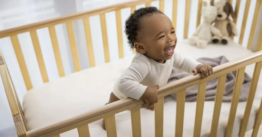 Baby in the Crib with Mattress Support Set to the Middle Height